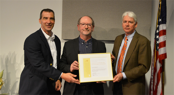 Nick Glumac, David Frost, and Ton Jacobi hold the Soo Lecture certificate.