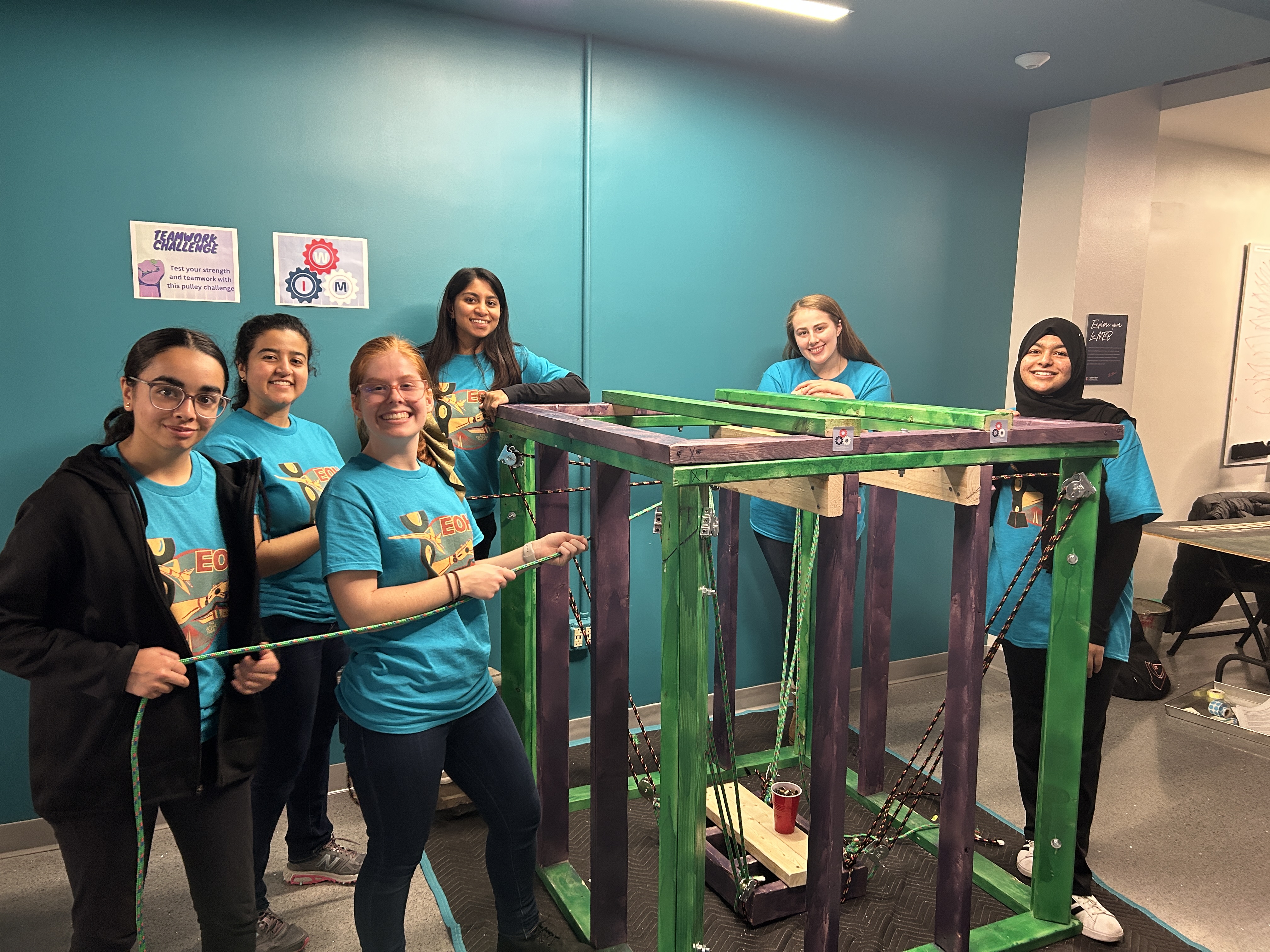 Women in MechSE with their EOH exhibit