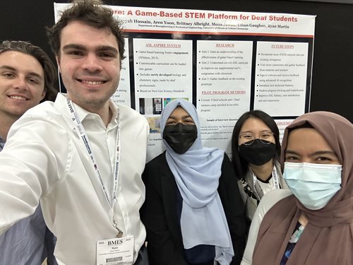 group of students with their research poster