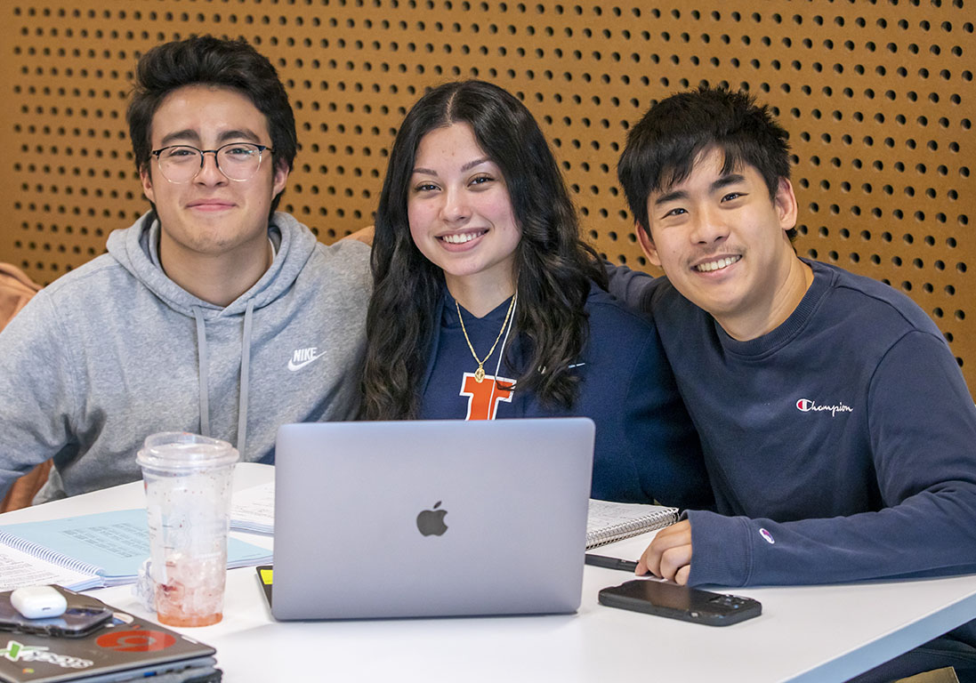 photo of three students smiling