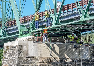 Men on a bridge contstuction project.