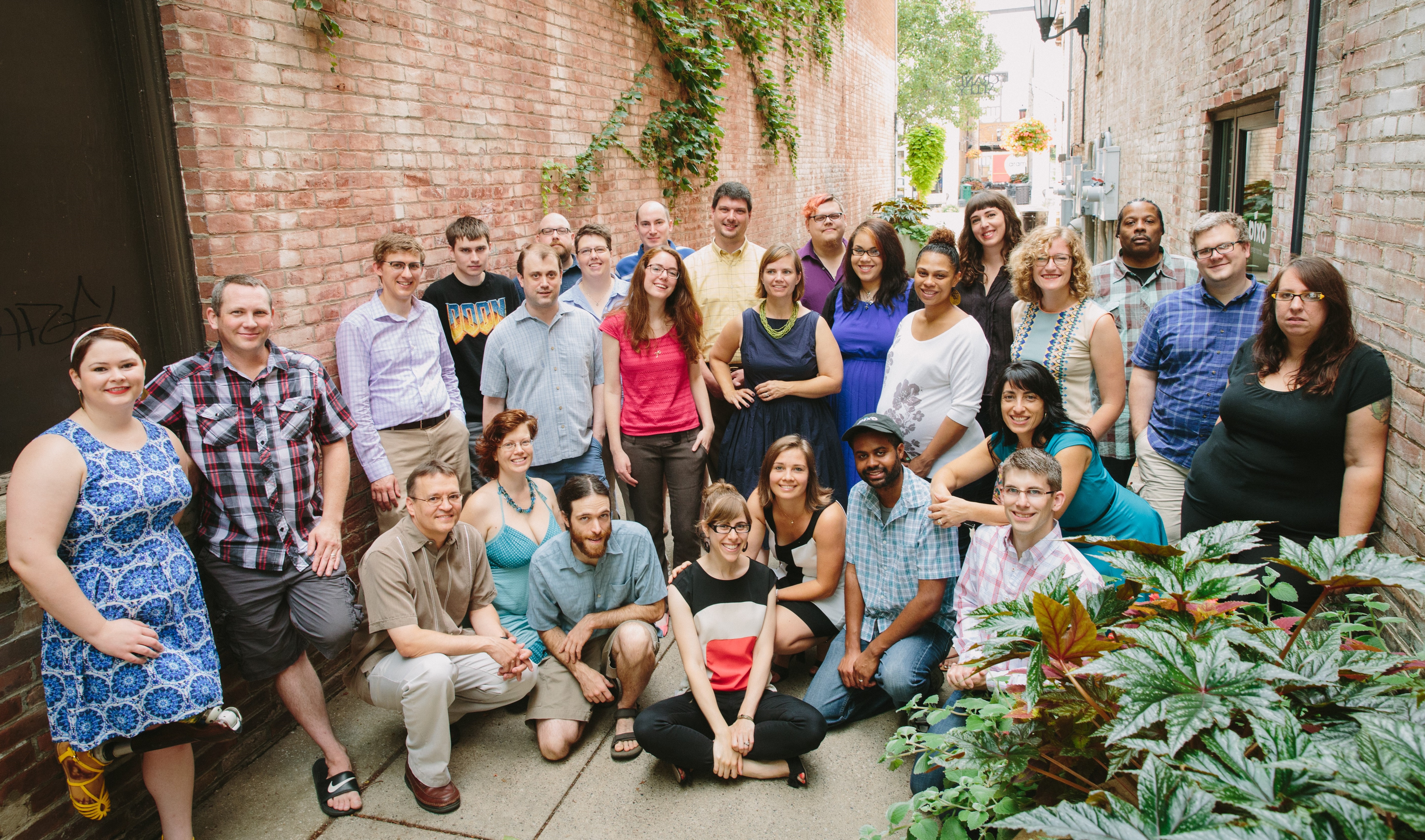 Group photo of Pixo staff outside their headquarters in Urbana, IL.