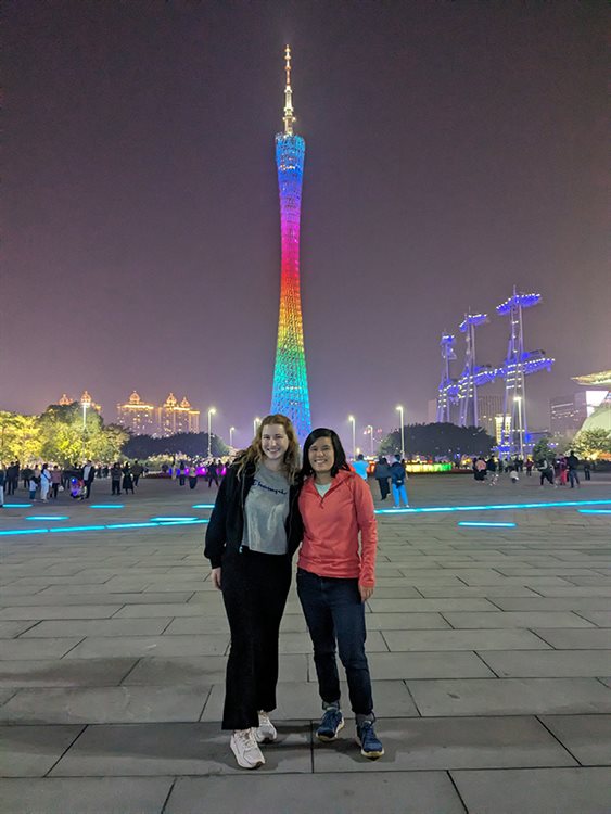 two female students with the Seattle space needle behind them.